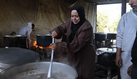 Members of an ActionAid partner organisation, the Women and Child Care Association (WEFAQ), distributing food in Gaza.