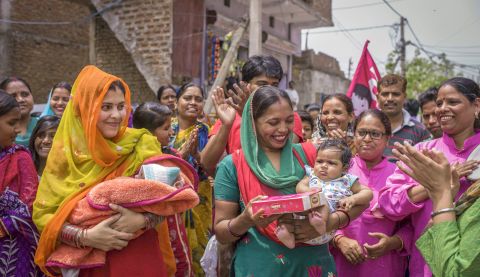 Mothers with their new born daughters at Beti Utsav celebration at Bhalswa, New Delhi