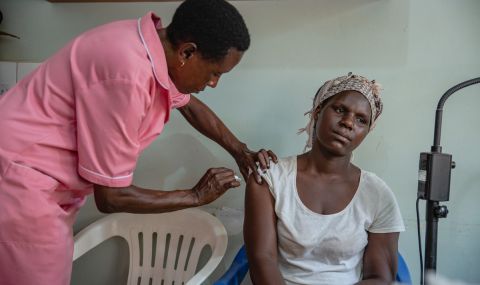 Nurse Margaret Kasolo, 57, gives a family planning injection to a client at Kawala Health Center IV in Kampala, Uganda. She has been a midwife for 35 years and has worked with Action Aid since 2013 as a Gender Based Violence focal person at the hospital.