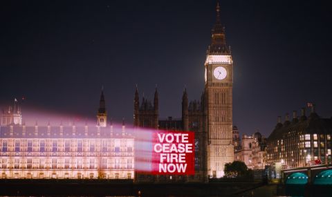 vote ceasefire now projected onto houses of parliament