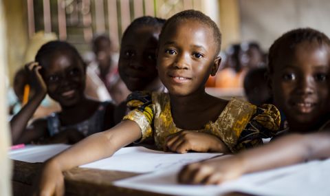 Six-year-old Mariama sits in class with her friends at her primary school, sponsored by ActionAid, in Sierra Leone