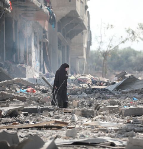 A woman resident of Gaza City searches the rubble for belongings in the aftermath of bombing by the Israeli army. 10th October 23