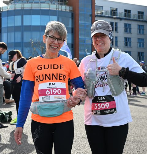 Ladies smile at Reading Half Marathon 2024.