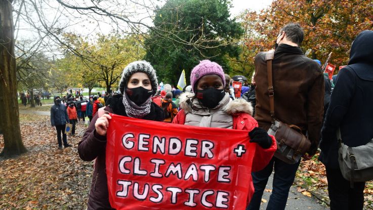 Climate activists Monicah Kamandau from Kenya and Safa Almomani from Jordan at the Global Day of Action march in Glasgow