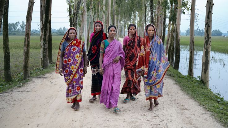 Uzala (centre) and other members of a women farmers' group in Bangladesh.