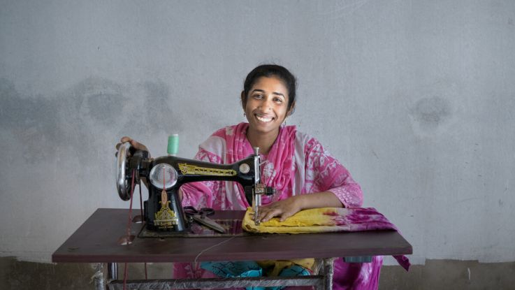 Moriom, 27, a mother of two who survived the Rana Plaza collapse. She accessed training and received a sewing machine from ActionAid's partner to help her back into work.