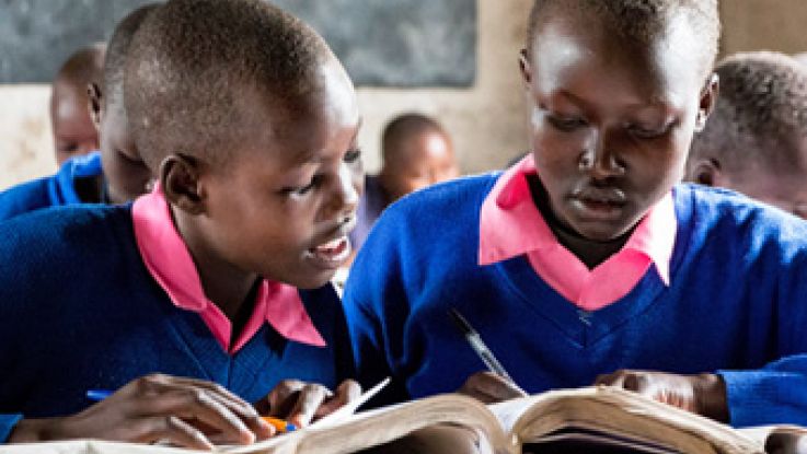 Students Abigail (R) and Purity (L) in class at school in West Pokot, Kenya.