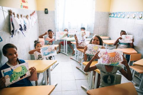 Sponsored children in Brazil writing messages and creating drawings for their sponsors.